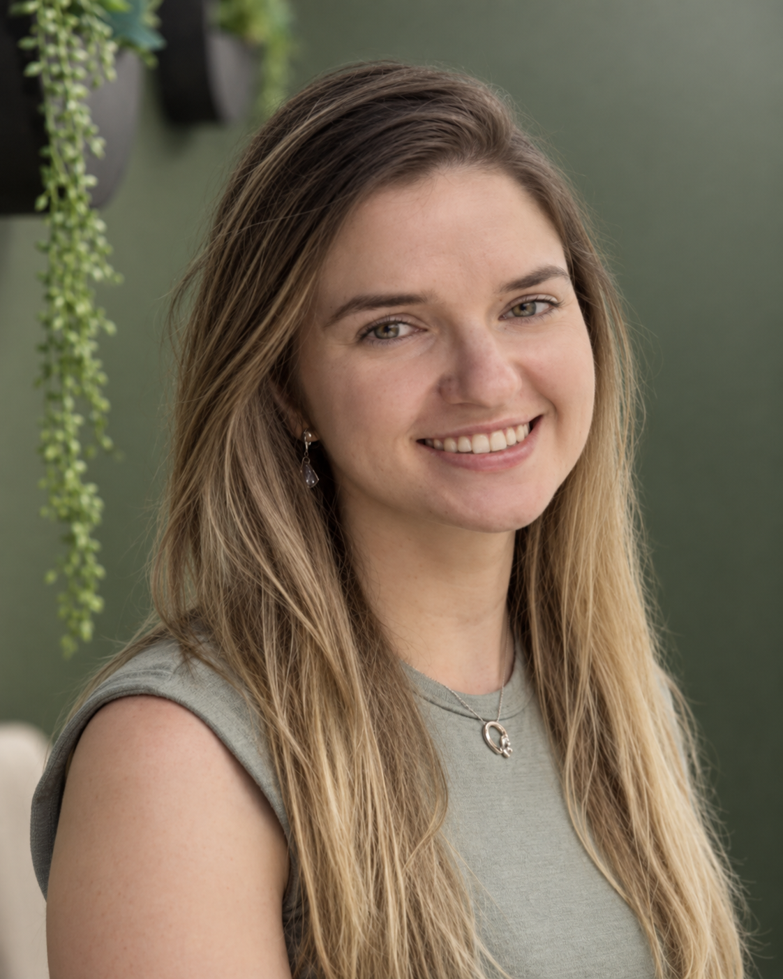 Diana Arnautu against a soft green background