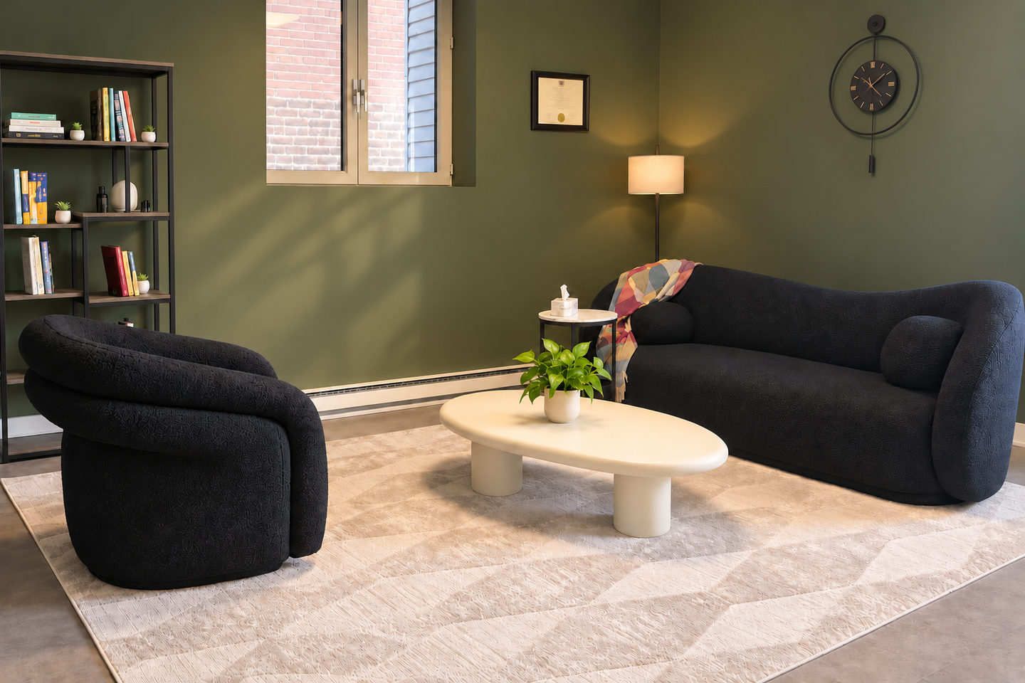 Two seats facing each other in the office, with a plant on the table between them